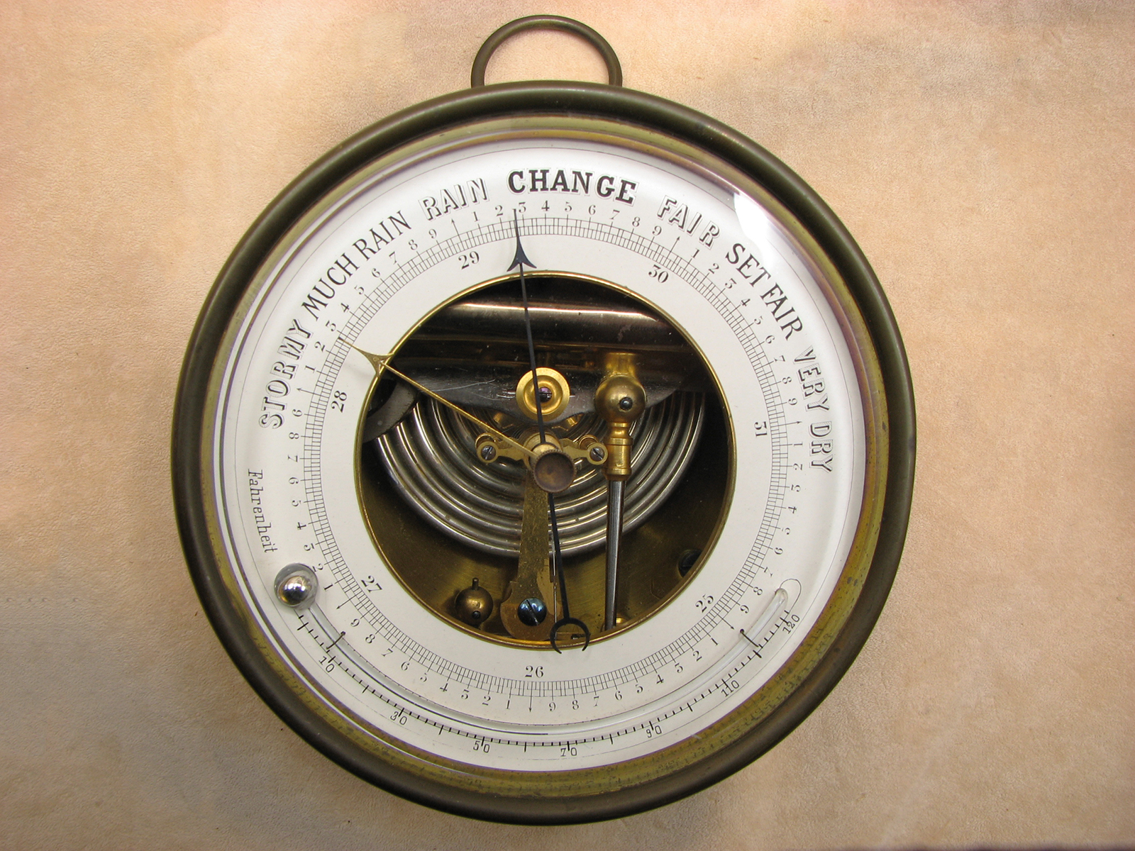 19th century aneroid barometer with curved thermometer